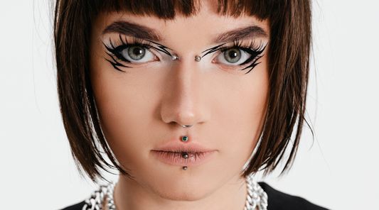 stylish woman with medusa and bridge piercing