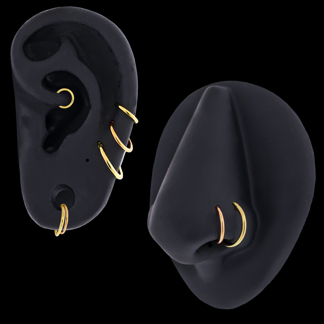 seamless gold rings on black silicone ear and nose on a black background