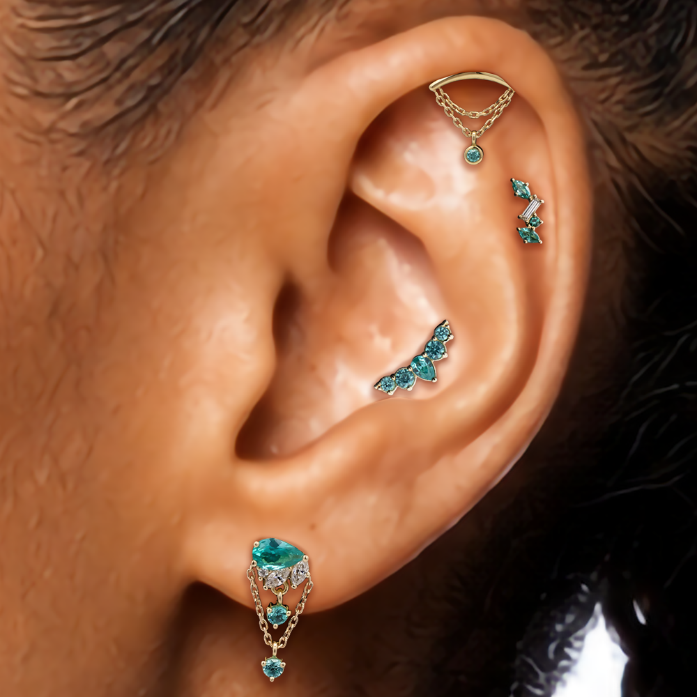 ear curation with teal gems