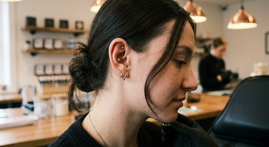 side view of a woman with a conch piercing in her ear curation