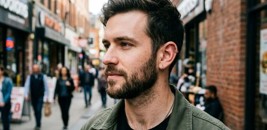 man with ear piercings