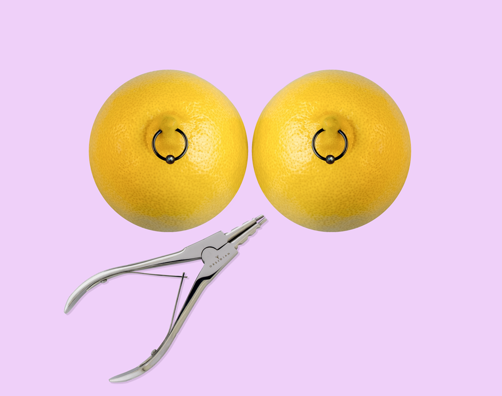 lemon with nipple rings and a ring opener