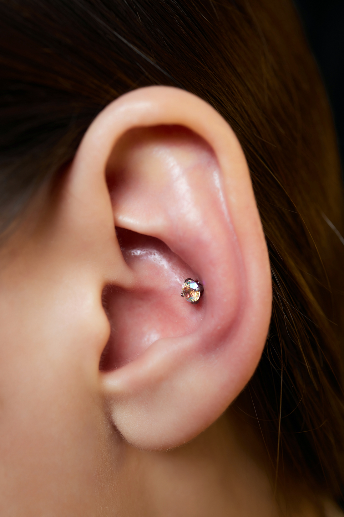 side view of the ear with conch piercing