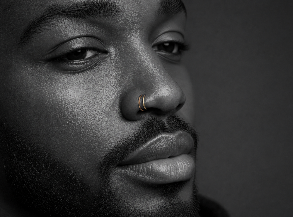 mean with double nostril gold hoop piercing
