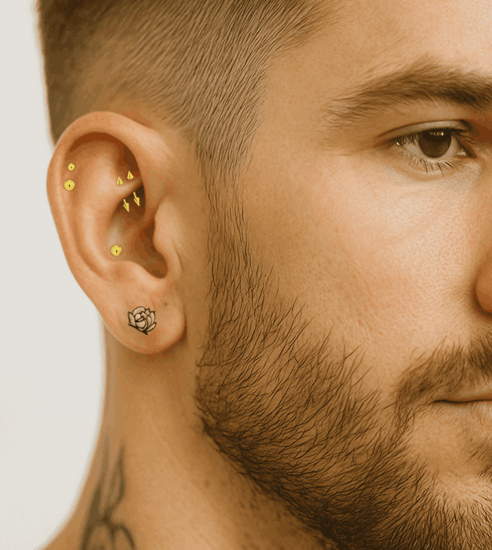 man with ear and tattoo piercings