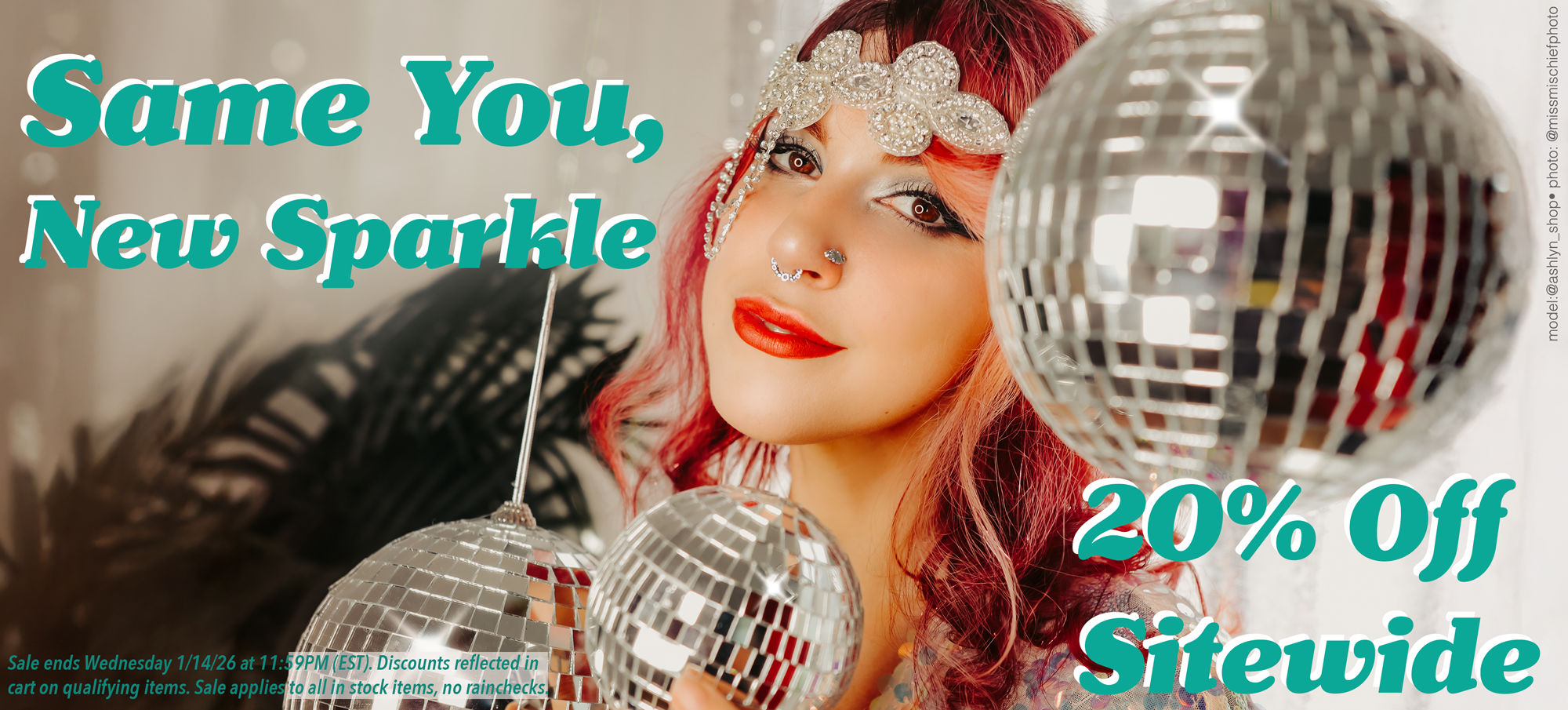 pierced woman with disco balls celebrating the new year in style