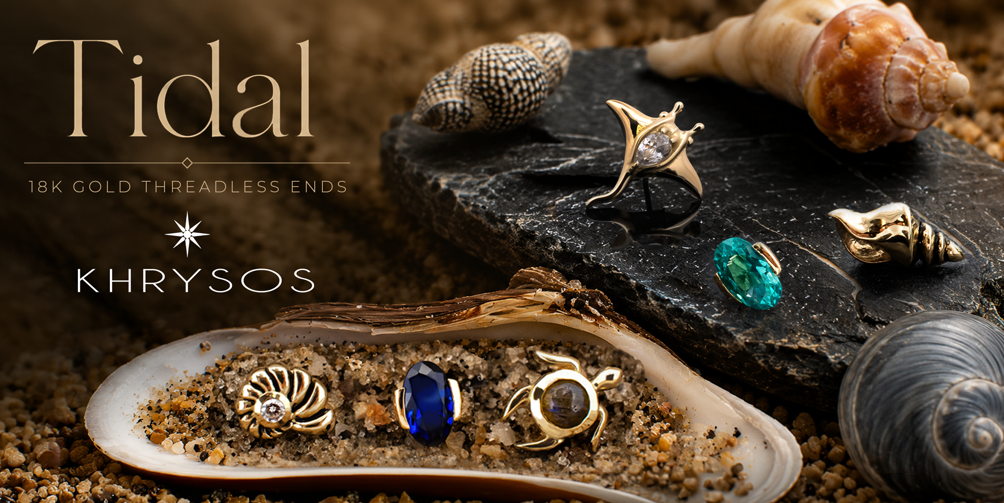 sand and shells showing off the 18kt gold khrysos tidal body jewelry collection