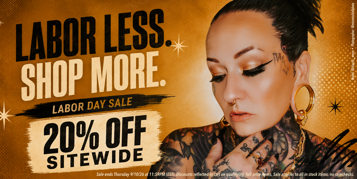 Pierced Woman with tattoos announcing a labor day sale